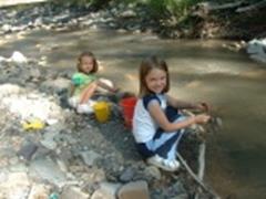 Kids playing by creek