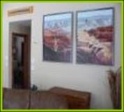 Living Room original paintings of Grand Canyon in Bullion Creekside Cabin near Marysvale Utah