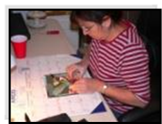 Ana Maria working on her 'Rufus Hummingbird' mosaic picture. Ana's art and jewelry is available in Marysvale Utah.